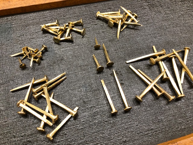 Brass  trunk nails for sale by the pound