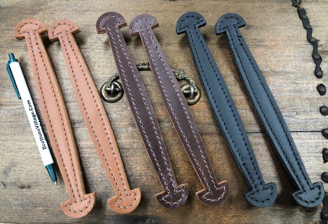 Small handles for typewriters and suitcases made from stitched leather